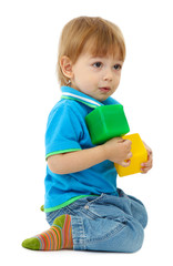 cute little boy with toy color cubes, isolated on white