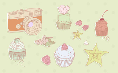 Photo camera, cakes and fruits