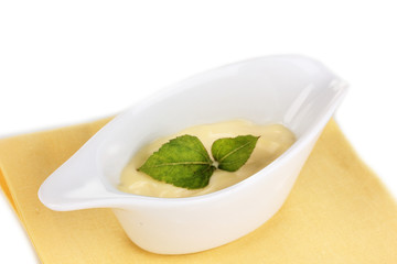 Mayonnaise in bowl on napkin isolated on white