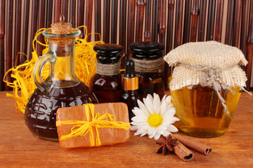 ingredients for soap making on brown background
