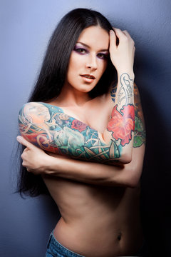 Beautiful sexy glamorous girl with tattoos.
