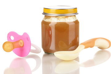 Useful and tasty baby food with beige small spoon isolated