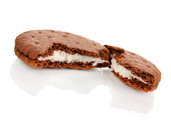 Chocolate cookies with creamy layer isolated on white