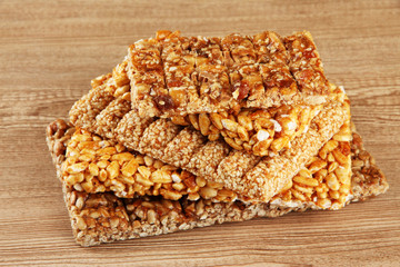 tasty sweets (kozinaki), on wooden background