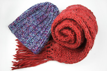 blue winter cap and red scarf isolated on white background