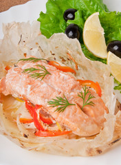 Baked salmon with vegetables in an envelope 