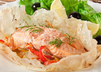 Baked salmon with vegetables in an envelope 