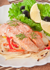 Baked salmon with vegetables in an envelope 