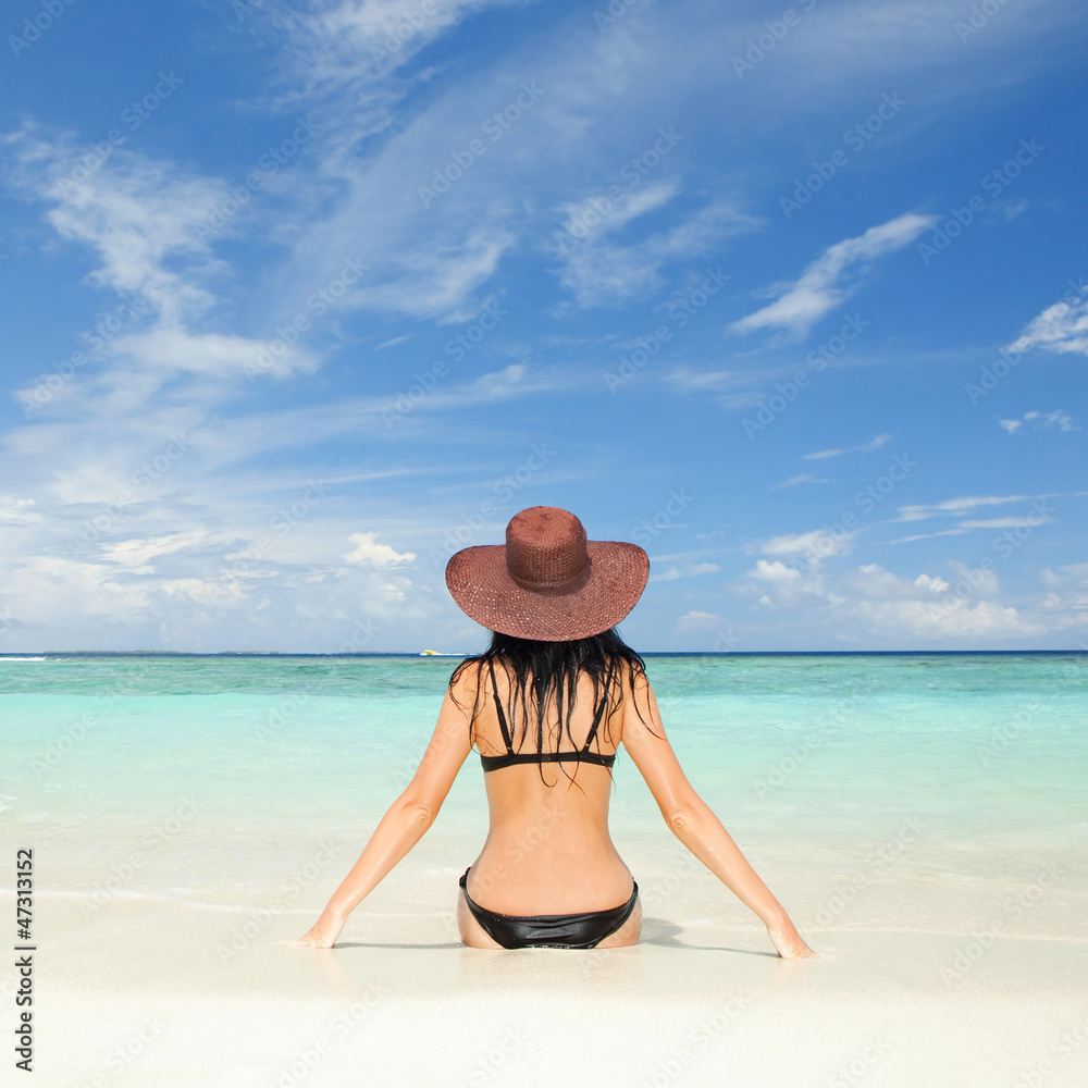 Wall mural young fashion woman on the beach