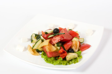 Vegetable salad on plate isolated on white