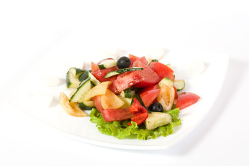 Vegetable salad on plate isolated on white
