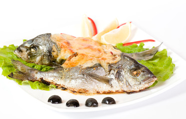 Fried fish garnished on sliced olive and sauce