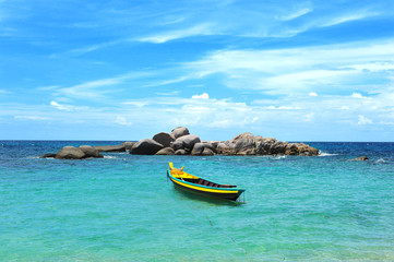 Fototapeta na wymiar Yellow boat in the turquoise tropical sea, Koh Tao, Thailand