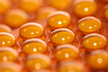 Background from macro of yellow medicine pills