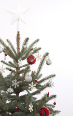 decorated christmas tree on white background with gifts