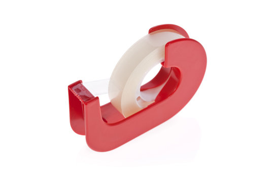 Clear tape dispenser isolated on a white background.