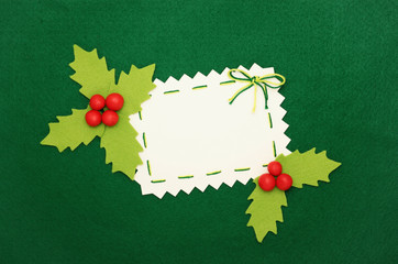 Christmas card: empty  blank and holly on green background