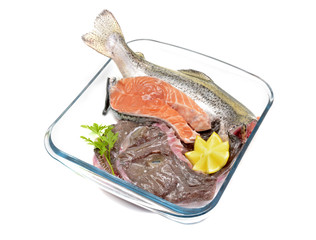 Different uncooked fish: monkfish, salmon and seabream