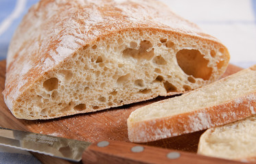 Italian ciabatta bread on the wooden board