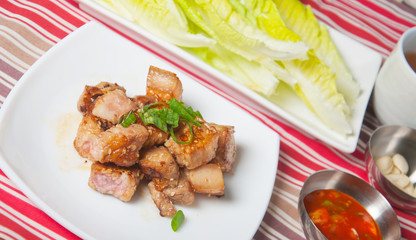 grilled pork wrapped in vegetables with garlic and soybean paste