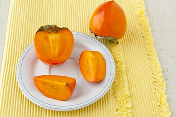 Ripe persimmon with cut