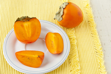 Ripe persimmon with cut