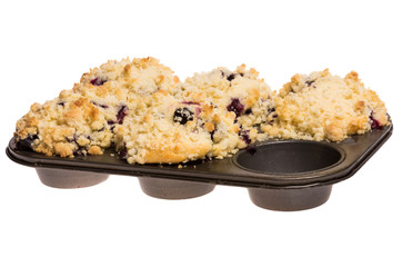 Baking pan with group of fresh blueberry muffins