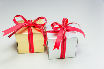 silver and gold small gift box in row