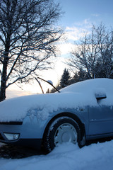 Car after winter day snowfall