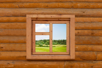  field is visible from a window in the wooden rural house