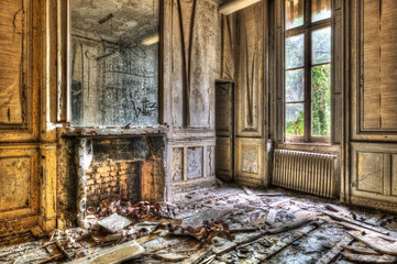 Broken fireplace in an abandoned derelict room