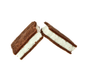 Broken chocolate biscuits on a white background