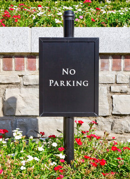 Nice and polite No Parking sign with flowers