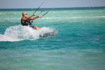 Kiteboarder enjoy surfing