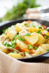 Potato gratin in a round pan