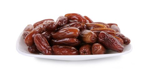 Fresh dates on white plate isolated on white background