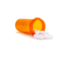 Medication pills in pills bottle isolated on white
