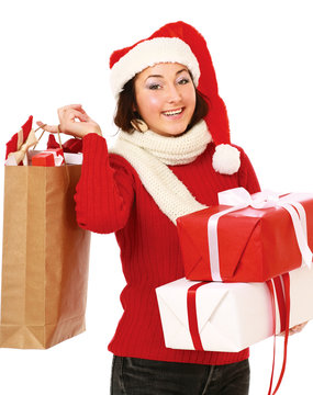 young woman with Santa hat holding shopping bags