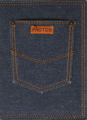 Fragment of jeans with pocket and label with text