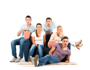 Fototapeta premium Young people sitting on a sofa on white background