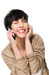 Beautiful girl winking while using cell phone