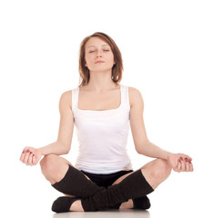 Young woman meditating in pose of lotus