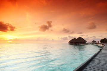 maldivian houses on sunrise