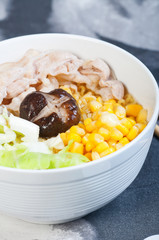 sliced pork with vegetables and buttered corn ramen
