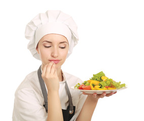 Pretty cook chief holding salad