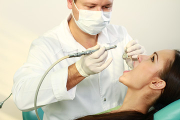 Young woman with dentist in a dental surgery