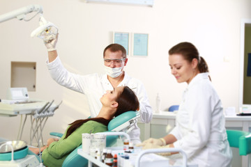 Young woman with dentist in a dental surgery