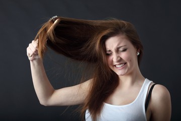 young beautiful woman with long hair and hairbrush