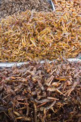 Snack ( fried grasshoppers) © adikpixxx