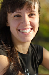 Fototapeta premium Vivacious young woman laughing